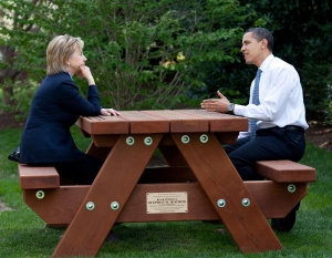 President Barack Obama and Secretary of State Hillary Rodham Clinton speak together sitting at a picnic table April 9, 2009, on the South Lawn of the White House. Official White House Photo by Pete Souza